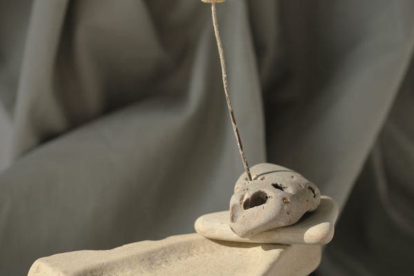 Zen garden elements like stacked stones and sand ripples.